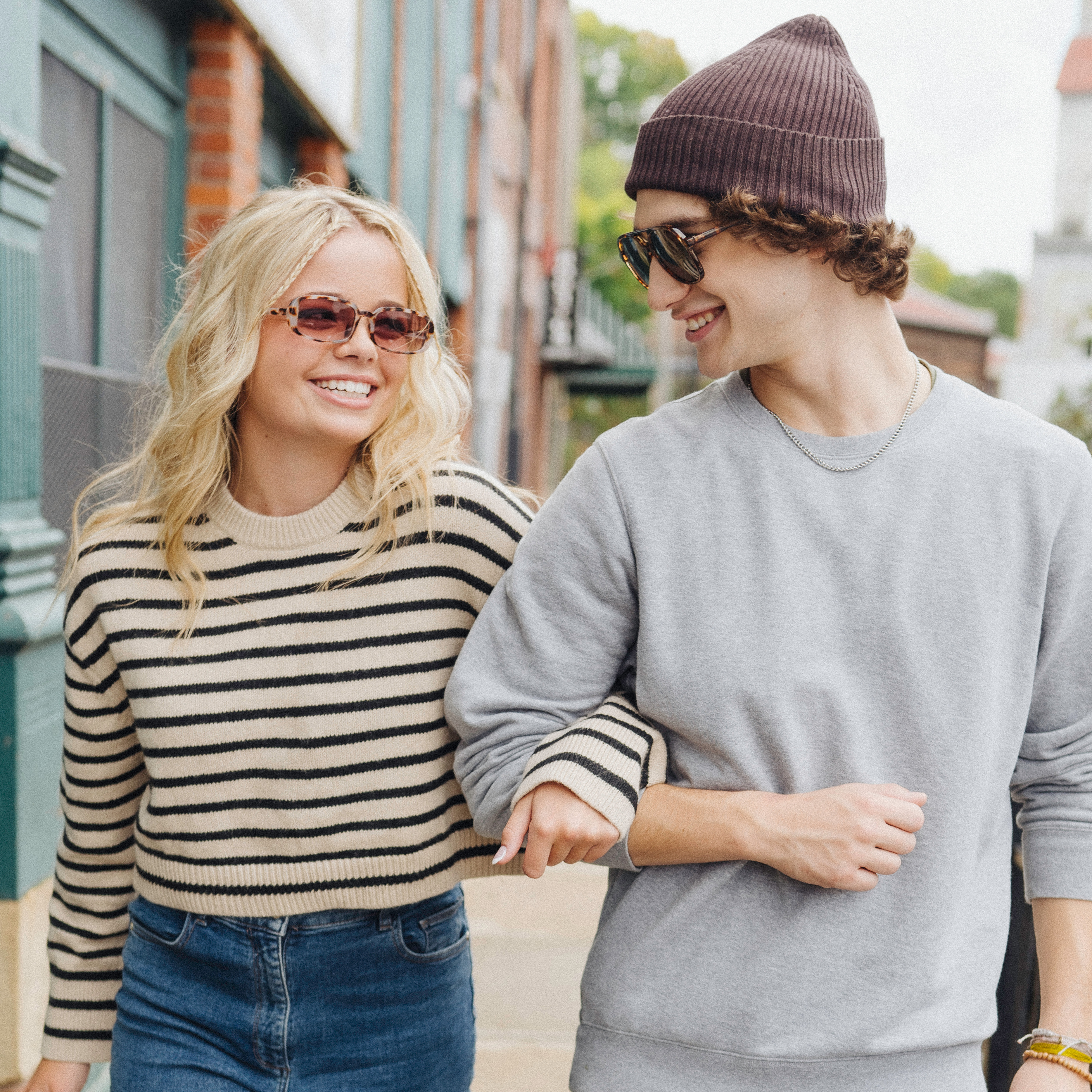 Smiling couple in affordable outfits from Plato's Closet